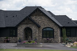 Black Hardie house with rock viklund contracting Carstairs
