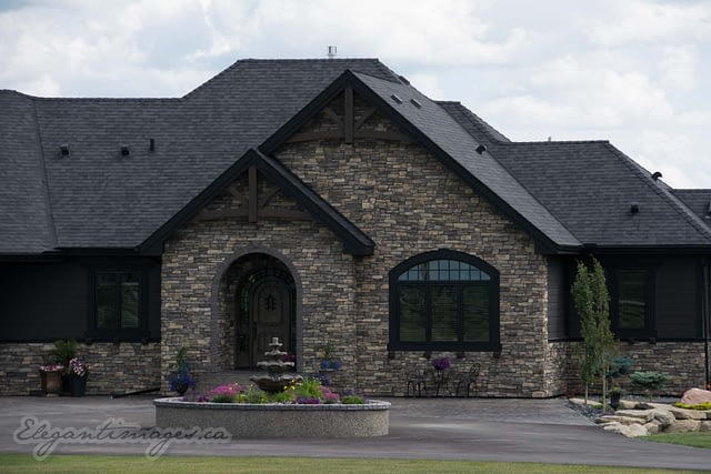 Black Hardie house with rock viklund contracting Carstairs