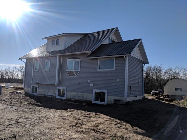 old-farm-house-gets-new-estate-grey-vinyl-siding